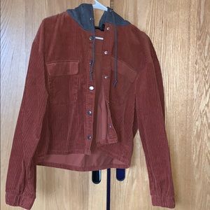 Corduroy red jacket with buttons.